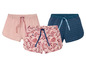 Drie dames shorts, een roze effen, een roze met bloemenprint en een blauwe met stippen
