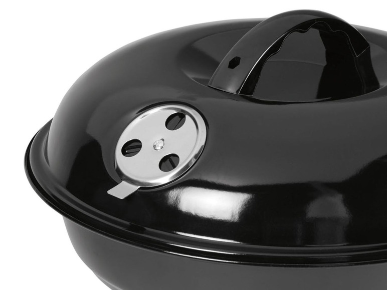 Zwarte deksel met handvat voor een barbecue.