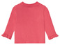 Roze longsleeve met ruches voor baby's.