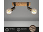 Twee-lichts plafondlamp met houten basis en verstelbare armaturen.