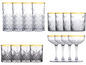 Set van 12 glazen, waaronder whiskyglazen en coupes met gouden rand.