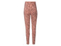 Roze leggings met bloemenprint.