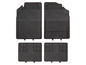 Vier zwarte rubberen vloermatten voor auto's.
