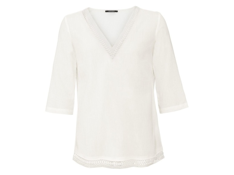 Witte blouse met v-hals en kantdetails.