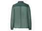 Een donkergroen, doorschijnend blouse met lange mouwen.