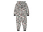 Een wit onesie met luipaardprint.