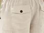 Beige linnen broek met steekzakken.