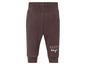 Bruine joggingbroek voor baby's met 'Happy Days' print.