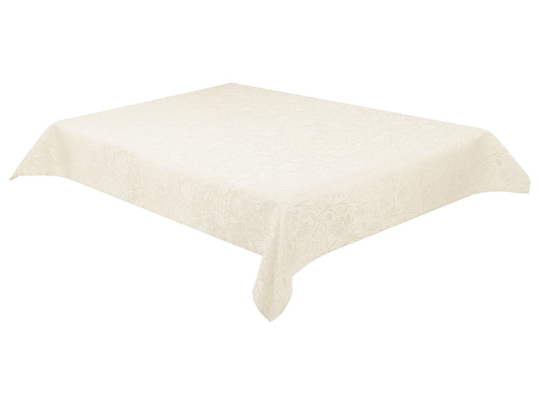 Een crèmekleurige tafelkleed met een bloemmotief.