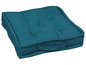 Een turquoise vloerkleed met handvat.