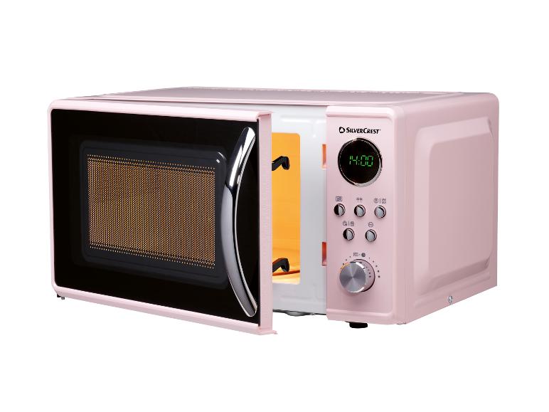 Een roze retro magnetron van SilverCrest met open deur.