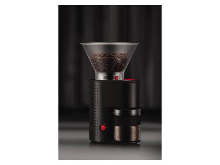 Zwarte koffiemolen met transparant bonenreservoir en opvangbak voor gemalen koffie.