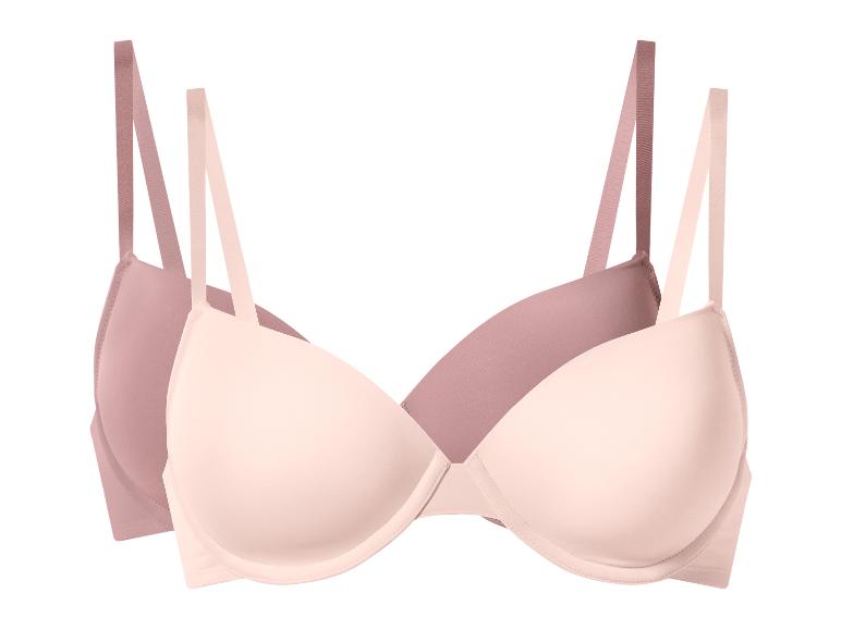 Twee beha's in roze en beige kleuren.