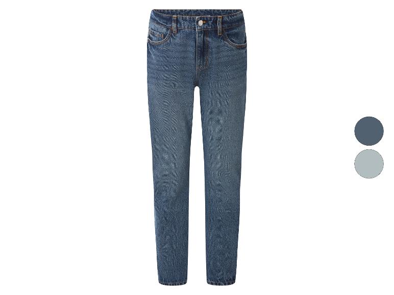 Blauwe damesjeans met twee kleurcirkels aan de rechterkant.