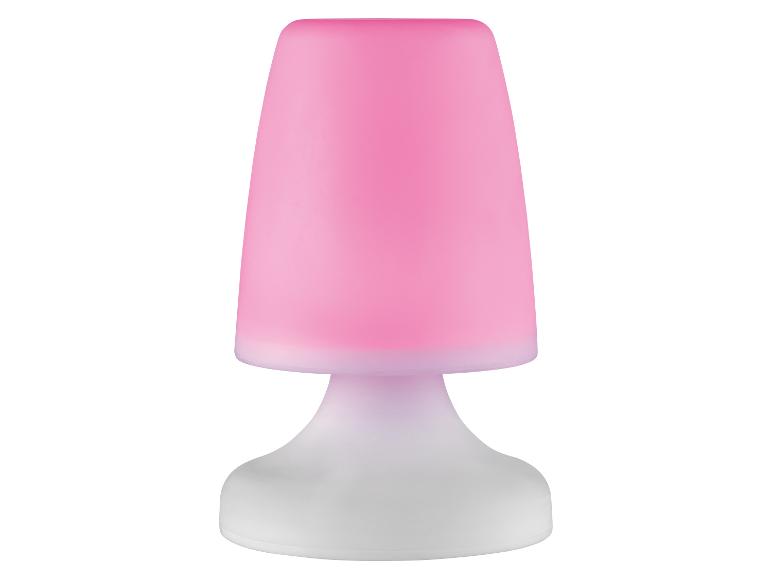 Kleine roze tafellamp met witte voet.