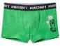 Groene boxershort met zwarte tailleband met witte tekst en een gepixelde figuur met palmbomen.