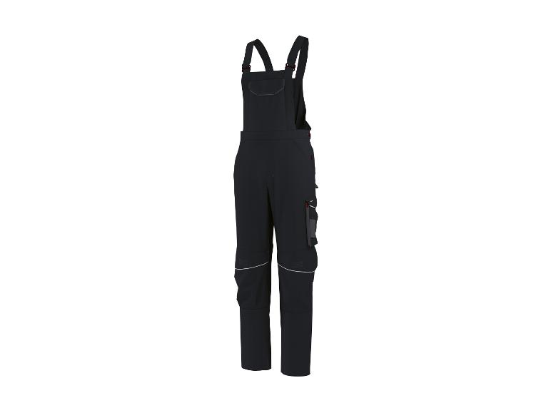 Zwarte werkbroek met bretels en reflecterende details.