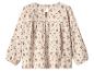 Crèmekleurige kinderblouse met lange mouwen en bloemenprint.