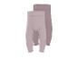 Twee geribbelde baby leggings in lichtroze en beige.