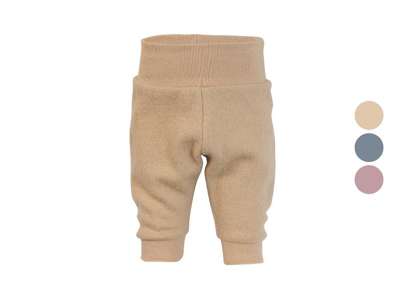 Beige babybroek met hoge geribbelde taille en boorden, met kleuropties.