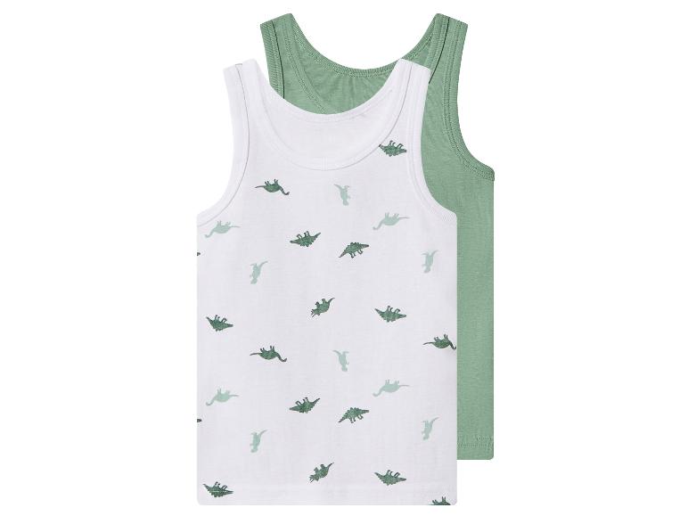 Twee kinderonderhemden, één wit met groene dinoprint en één effen groen.