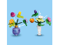 Twee kleurrijke speelgoedboeketten met verwisselbare bloemen en vazen.
