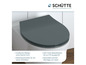 Een grijs toiletbril met een zachtsluitende functie van Schütte.