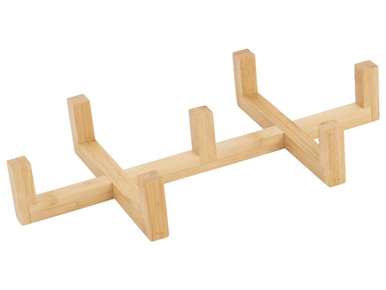 Houten rek voor borden of deksels, gemaakt van licht bamboehout.