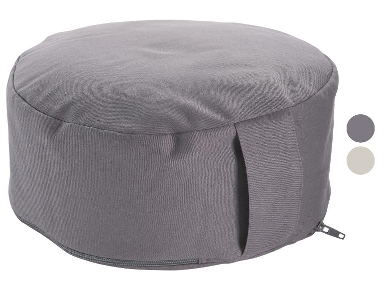 Een grijs meditatiekussen met een rits