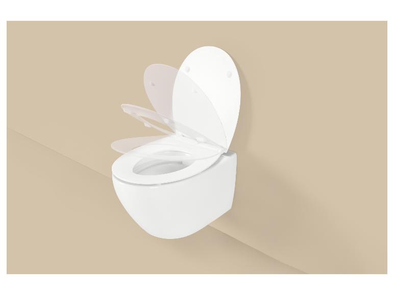 Soft-close toiletzitting in beweging op een beige achtergrond