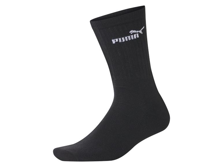Zwarte Puma sok met wit logo op de enkel