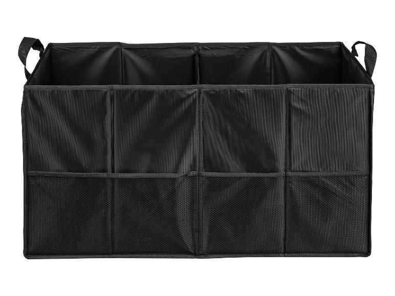 Een zwarte opbergbox met gaasvakken.