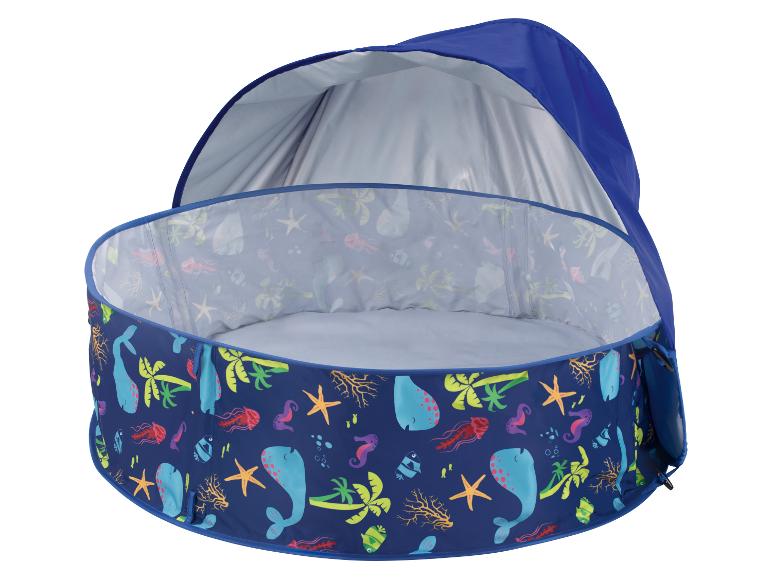 Blauw babyzwembad met zeethema en zonnescherm.