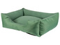 Een groene hondenmand met een kussen.