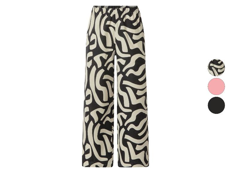 Damesbroek met abstract zwart-wit patroon en elastische tailleband.