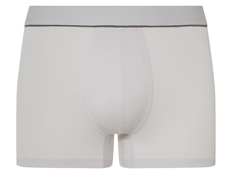 Witte herenboxershort met grijze elastische tailleband.