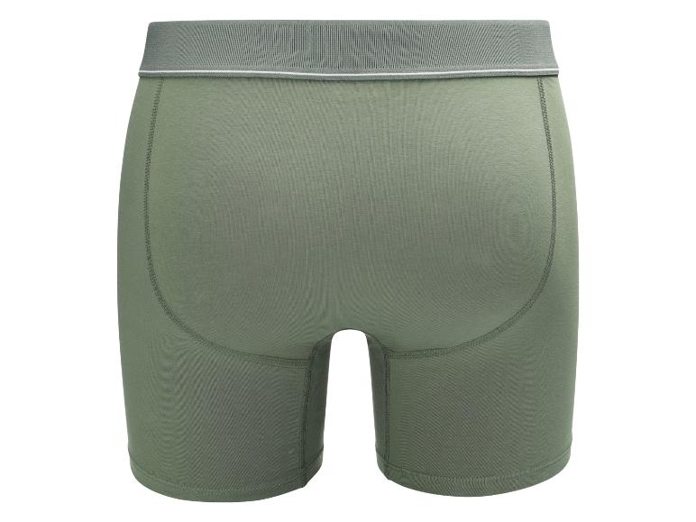 Groene herenboxershort met grijze elastische tailleband en zichtbare naden.
