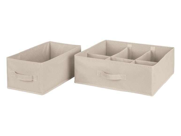 Twee beige opbergdozen, één met vakken