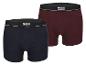 Twee MGXX Amsterdam boxershorts, donkerblauw en bordeauxrood.