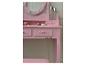 Roze kaptafel met spiegel en make-up artikelen