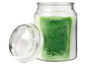 Een groene geurkaars in een glazen pot met deksel.