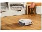 Robotstofzuiger op een houten vloer in een kinderkamer.