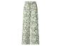 Groene wijde broek met witte bloemenprint.