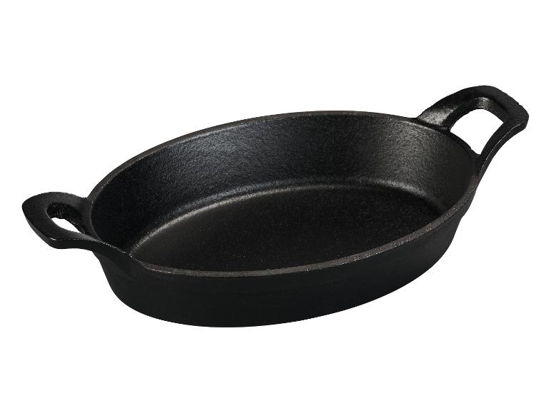 Zwarte, ovale gietijzeren pan met twee handvatten.