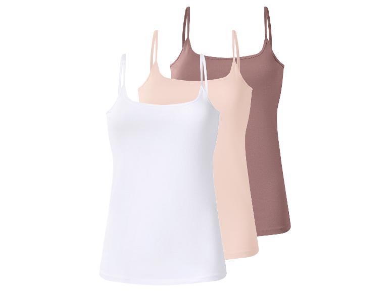 Drie dameshemdjes in wit, beige en bruin.