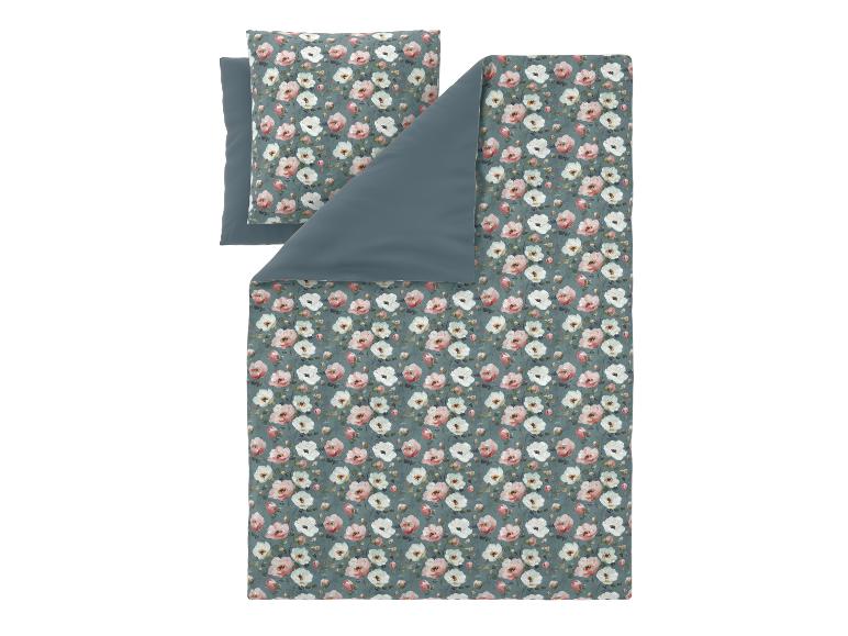 Dekbedovertrek en kussensloop set met roze en wit bloemenpatroon.