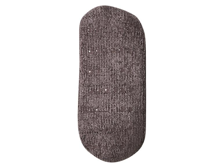 Grijze antislip sok met stippen aan de onderkant.