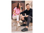 Man en vrouw dragen zwarte en witte sneakers van het merk Wanderlust.