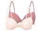 Twee beige bh's met roze bandjes.