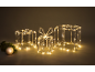 Drie verlichte geschenkdozen met kerstdecoraties